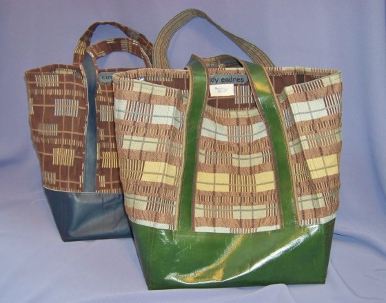Reusable shopping bag with leather bottom and handles