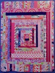 scrap quilt for baby Rachel Jane in expanded log cabin pattern